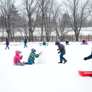 Children playing in the snow in a park