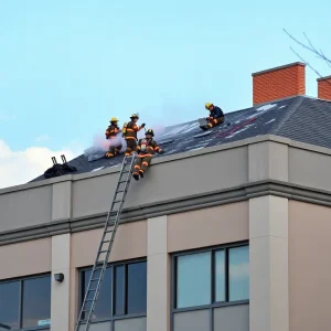 Firefighters managing a fire at a Kansas City commercial building.