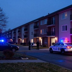 Police investigate a shooting scene at an apartment complex in Kansas City