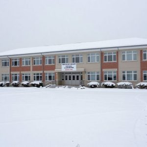 Kansas City school building in winter covered with snow