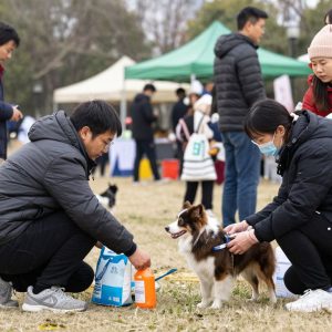 Community members receiving pet supplies at the Project Pet Warmth event.