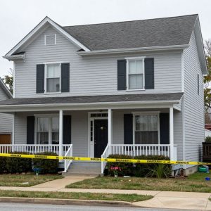 Exterior of a townhome in Riverside, Missouri, marked as a crime scene.