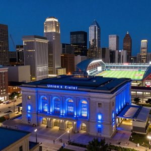 Union Station facade illuminated in blue to support the downtown stadium project