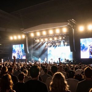 Concert crowd enjoying a live performance at Kauffman Stadium in Kansas City
