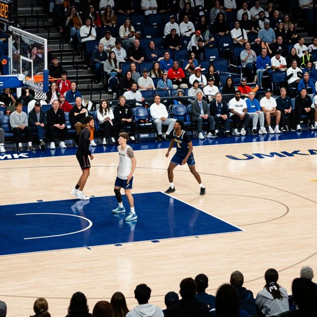 Players practicing on the UMKC basketball court